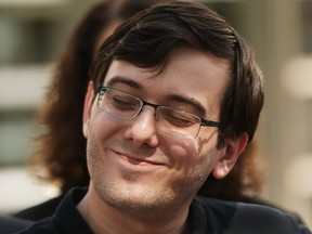 Former pharmaceutical executive Martin Shkreli smiles while speaking to the media in front of U.S. District Court for the Eastern District of New York with members of his legal team after the jury issued a verdict, August 4, 2017 in the Brooklyn borough of New York City.