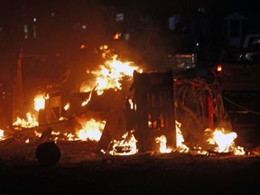 Cars burn after car bombs in Mogadishu, Somalia, Thursday Feb. 28, 2019. At least four people were killed in a powerful explosion late Thursday in the Somali capital, Mogadishu, police said, in an attack that Islamic extremists said was an attempt to bomb a hotel. Militants detonated a car bomb near the residence of Judge Abshir Omar, and security forces stationed outside the house fought off gunmen who tried to force their way into Omar's house, police officer Mohamed Hussein told The Associated Press.