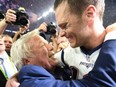 In this file photo taken on February 5, 2017, New England Patriots owner Robert Kraft and Tom Brady of the New England Patriots celebrate after defeating the Atlanta Falcons during Super Bowl 51 in Houston, Texas.