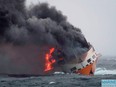 This handout picture released on March 12, 2019 by the French Marine Nationale shows flames on the Italian merchant ship Grande America in the Gascogne Gulf, off the western French coast.