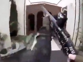 This image grab from a self-shot video that was streamed on Facebook Live on March 15, 2019 by the man who was involved in two mosque shootings in Christchurch shows the man holding a gun as he enters the Masjid al Noor mosque.