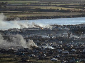 Smoke rises in ISIL's last remaining position on the eastern banks of the Euphrates River in the village of Baghouz during battles with the Syrian Democratic Forces (SDF), in the eastern Syrian province of Deir Ezzor, on March 18, 2019.