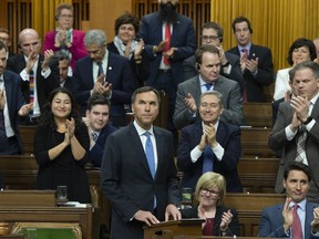 Finance Minister Bill Morneau receives a standing ovation from members as he delivers the federal budget in the House of Commons in Ottawa, Tuesday March 19, 2019.