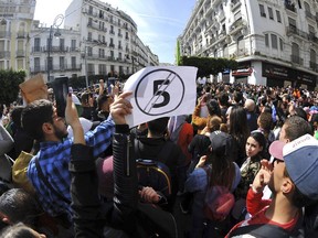 Hundreds of students gather in central Algiers to protest Algerian President Abdelaziz Bouteflika's decision to seek fifth term, Tuesday, March 6, 2019. Algerian students are gathering for new protests and are calling for a general strike if he doesn't meet their demands this week.