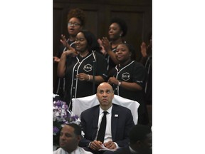 U.S. Sen. Cory Booker, D-N.J., listens to the choir sing before speaking during a commemorative service marking the anniversary of "Bloody Sunday"  at Brown Chapel AME Church in Selma, Ala., Sunday, March 3, 2019.  Several Democratic White House hopefuls are visiting one of America's seminal civil rights sites to pay homage to that legacy and highlight their own connections to the movement.