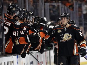 Anaheim Ducks' Rickard Rakell, right, celebrates his goal with teammates during the first period of an NHL hockey game Friday, March 22, 2019, in Anaheim, Calif.