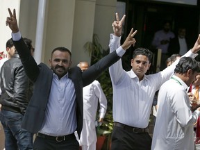 Supporters of former Pakistani Prime Minister Nawaz Sharif flash victory signs following a supreme court decision, in Islamabad, Pakistan, Tuesday, March 26, 2019. In a Tuesday ruling the supreme court granted six weeks' bail to Sharif for medical treatment at a domestic hospital. The court said Sharif -- who has heart-related issues -- will not be allowed to leave the country.