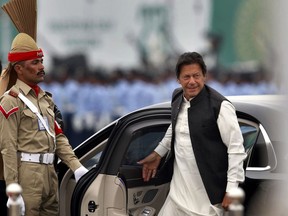 Pakistani Prime Minister Imran Khan arrives to attend a military parade to mark Pakistan National Day, in Islamabad, Pakistan, Saturday, March 23, 2019. Pakistanis are celebrating their National Day with a military parade that's showcasing short- and long-range missiles, tanks, jets, drones, and other hardware.