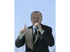 Turkey's President Recep Tayyip Erdogan addresses supporters of his ruling Justice and Development Party during a rally in Eregli, Turkey, Tuesday, March 19, 2019. Ignoring widespread criticism, Erdogan has again shown excerpts of a video taken by the attacker who killed 50 people in mosques in New Zealand at a campaign rally. (Presidential Press Service via AP, Pool)