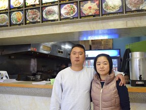 In this undated photo released by Amber Taylor, Wanrong Lin, left, and his wife, Hui Fang Dong, pose for a photo. Wanrong Lin, a Maryland resident whose deportation was blocked by a federal judge while he was on a flight in November to his native China is seeking a court order allowing him to remain in the U.S. with his family. U.S. District Judge George Hazel is scheduled to hear arguments Friday, March 15, 2019, from attorneys for Wanrong Lin and the federal government.