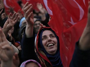 Supporters of Turkey's President Recep Tayyip Erdogan cheers as he arrives at a rally of his ruling Justice and Development Party's (AKP), in Istanbul, Friday, March 29, 2019, ahead of local elections scheduled for March 31, 2019. Erdogan has been holding multiple daily rallies across the country, using highly polarising language, portraying the opposition as traitors who are supported by terrorists.