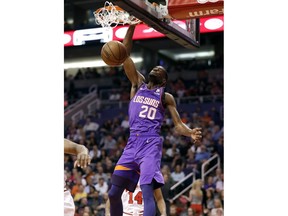 Phoenix Suns forward Josh Jackson (20) dunks against the Chicago Bulls during the first half of an NBA basketball game, Monday, March 18, 2019, in Phoenix.