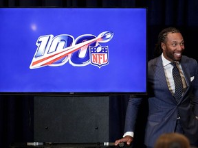 Arizona Cardinals' Larry Fitzgerald listens during a news conference on social justice during the annual NFL football owners meetings, Monday, March 25, 2019, in Phoenix.