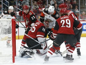 Anaheim Ducks center Derek Grant (38) tries to score against Arizona Coyotes goaltender Darcy Kuemper (35) in the first period during an NHL hockey game, Thursday, March 14, 2019, in Glendale, Ariz.