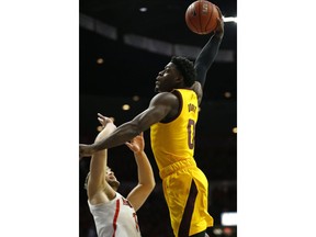 Arizona State guard Luguentz Dort (0) dunks over Arizona forward Ryan Luther in the first half during an NCAA college basketball game, Saturday, March 9, 2019, in Tucson, Ariz.