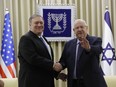 U.S. Secretary of State Mike Pompeo, left, and Israeli President Reuven Rivlin shake hands during their meeting in Jerusalem Thursday, March 21, 2019.