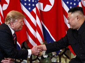 FILE - In this Wednesday, Feb. 27, 2019, file photo, U.S. President Donald Trump shakes hands with North Korean leader Kim Jong Un in Hanoi. Trump said he walked away from his second summit with North Korean leader Kim Jong Un because Kim demanded the U.S. lift all of its sanctions, a claim that North Korea's delegation called a rare news conference in the middle of the night to deny.