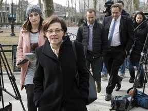 Nancy Salzman, center, arrives at Brooklyn federal court, Wednesday, March 13, 2019, in New York.