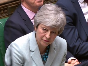 A video grab from footage broadcast by the UK Parliament's Parliamentary Recording Unit (PRU) shows Britain's Prime Minister Theresa May listens as Scottish National Party (SNP) MP and Westminster leader Ian Blackford speaks in the House of Commons in London on March 25, 2019 after May outlined the next steps that parliament will take in the Brexit process. Accused of presiding over an unprecedented national humiliation in her chaotic handling of Brexit, British Prime Minister Theresa May has all but lost control of her party and her government.