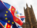 Anti-Brexit protesters demonstrate outside the Houses of Parliament in London, March 26, 2019.