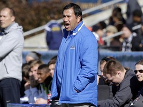 FILE - In this Dec. 14, 2014 file photo, UCLA coach Jorge Salcedo reacts during the first half of an NCAA College Cup championship soccer game against Virginia in Cary, N.C. Salcedo was charged along with nearly 50 other people Tuesday, March 12, 2019, in a scheme in which wealthy parents bribed college coaches and insiders at testing centers to get their children into some of the most elite schools in the country, federal prosecutors said. UCLA said that Salcedo has been placed on leave pending a review and will have no involvement with the team.