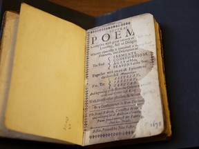 In this Wednesday, March 20, 2019, photo, a 1678 edition of the book: "Several Poems Compiled with Great Variety of Wit and Learning," commonly referred to as "The Tenth Muse," by 17th century American poet Anne Bradstreet, is open to the title page as it rests on a table at the Houghton Library on the campus of Harvard University, in Cambridge, Mass. Anne Bradstreet was the North American continent's first published poet. Her actual burial place is not known. (Courtesy of Harvard University via AP)