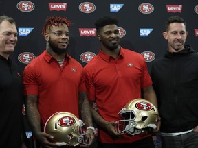 From left, San Francisco 49ers General Manager John Lynch, Kwon Alexander, Dee Ford and coach Kyle Shanahan stand for a photo following an NFL news conference Thursday, March 14, 2019, in Santa Clara, Calif.