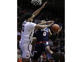 Pacific's Jeremiah Bailey, left, defends against Gonzaga's Geno Crandall (0) in the first half of an NCAA college basketball game Thursday, Feb. 28, 2019, in Stockton, Calif.