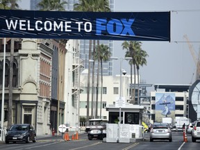 Cars enter and leave Fox Studios, Tuesday, March 19, 2019, in Los Angeles. Disney has closed its $71 acquisition of Fox's entertainment business on Wednesday, March 20, in a move set to shake up the media landscape. The closure paves the way for Disney to launch its streaming service, Disney Plus, due out later this year.