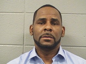 In this Wednesday, March 6, 2019 booking photo released by the Cook County Sheriff's Office is R. Kelly. A Cook County Sheriff's Office official says singer Kelly won't be released from jail until he pays $161,000 in back child support he owes. Sheriff's office spokeswoman Sophia Ansari says Kelly was taken into custody Wednesday during a hearing over the child support and that his next hearing is scheduled for next Wednesday, March 13. (Cook County Sheriff's Office via AP)