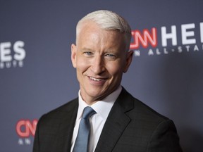 FILE - In this Dec. 9, 2018 file photo, host Anderson Cooper attends the 12th annual CNN Heroes: An All-Star Tribute at the American Museum of Natural History, in New York. Cooper has a 2-book deal and plans for collaborating with historian-novelist Katherine Howe. Harper announced Tuesday, March 19, 2019, that the CNN anchor and "60 Minutes" correspondent will work on two books of nonfiction with Howe, who specializes in novels about witchcraft, including "The Daughters of Temperance Hobbs" and "The Physick Book of Deliverance Dane."