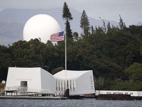FILE - In this Dec. 27, 2016, file photo, USS Arizona Memorial, part of the World War II Valor in the Pacific National Monument, is seen at Joint Base Pearl Harbor-Hickam, Hawaii. Repairs to the USS Arizona Memorial are expected to keep the dock closed through the summer. The National Park Service has awarded a $2.1 million contract for repairs that are expected to be completed in time for the next Dec. 7, 1941, remembrance service, the Honolulu Star-Advertiser reported Thursday, March 28, 2019.