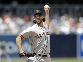 San Francisco Giants starting pitcher Madison Bumgarner works against a San Diego Padres batter during the first inning of a baseball game, Thursday, March 28, 2019, in San Diego.