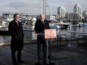 Premier John Horgan and federal Minister of Fisheries Jonathan Wilkinson make an announcement about the Salmon Restoration and Innovation Fund during a press conference at Fisherman's Wharf in Victoria, B.C., on Friday, March 15, 2019.