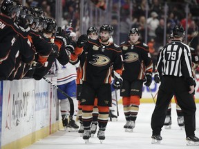 Anaheim Ducks' Adam Henrique, center, celebrates his goal with teammates during the first period of an NHL hockey game against the Montreal Canadiens on Friday, March 8, 2019, in Anaheim, Calif.