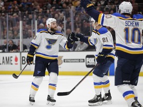 St. Louis Blues' Ryan O'Reilly, left, celebrates his goal with Tyler Bozak and Brayden Schenn during the first period of the team's NHL hockey game against the Anaheim Ducks on Wednesday, March 6, 2019, in Anaheim, Calif.