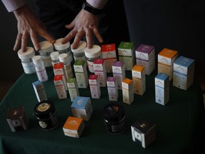 In this Feb. 19, 2019 photo, a vendor shows various cannabis products to retired seniors at Bud and Bloom cannabis dispensary in Santa Ana, Calif. More Americans in their 70s and 80s are adding marijuana use to their roster of senior activities. Recent studies show that people 65 and over are the fastest-growing segment of cannabis users.