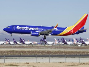 In this Saturday, March 23, 2019, photo, a Southwest Airlines Boeing 737 Max aircraft lands at the Southern California Logistics Airport in the high desert town of Victorville, Calif. Southwest, which has 34 Max aircraft, is making cancellations five days in advance, with an average of 130 daily cancellations.