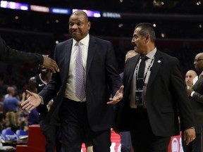 Los Angeles Clippers head coach Doc Rivers is escorted off the court after being ejected from an NBA basketball game against the Chicago Bulls Friday, March 15, 2019, in Los Angeles.