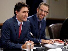 Prime Minister Justin Trudeau (L) and his then principal secretary Gerald Butts on Parliament Hill  on April 21, 2017.