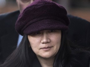 In this Jan. 29, 2019, file photo, Huawei chief financial officer Meng Wanzhou leaves her home to attend a court appearance in Vancouver, British Columbia.