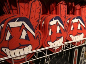 FILE - In this Jan. 29, 2018 file photo, foam images of the MLB baseball Cleveland Indians' mascot Chief Wahoo are displayed for sale at the Indians' team shop in Cleveland. The Chief Wahoo logo is being removed from the Cleveland Indians' uniform in the 2019 season, but the Club will still sell merchandise featuring the mascot in Northeast Ohio. The U.S. has spent most of 2019 coming to grips with blackface and racist imagery, but Native Americans say they don't see significant pressure applied to those who perpetuate Native American stereotypes.