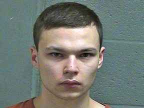 FILE--This March 4, 2019 booking photo released by the Oklahoma County Sheriff's Office shows Michael Elijah Walker. Police say the 19-year-old Oklahoma man told his younger brother that he fatally shot their parents because they were communicating with him telepathically and were Satan worshippers. Walker has pleaded not guilty to first-degree murder in his parents deaths and his attorney Derek Chance says he will seek to have Eli Walker declared mentally incompetent. (Oklahoma County Sheriff's Office via AP)