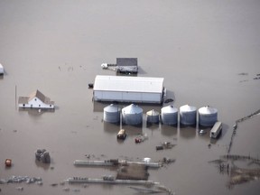 FILE - This Monday, March 18, 2019 file photo made by the South Dakota Civil Air Patrol and provided by the Iowa Department of Homeland Security and Emergency Management shows flooding along the Missouri River in rural Iowa north of Omaha, Neb. After massive flooding along the Missouri River in the spring of 2019, many want to blame the agency that manages the river's dams for making the disaster worse, but it may not be that simple. The U.S. Army Corps of Engineers says much of the water that created March's flooding came from rain and melting snow that flowed into the river downstream of all the dams, and at the same time, massive amounts of water filled the reservoirs and some had to be released. (Iowa Homeland Security and Emergency Management via AP, File )