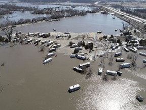 This Wednesday, March 20, 2019 aerial photo shows flooding near the Platte River in in Plattsmouth, Neb., south of Omaha. The National Weather Service is warning that flooding in parts of South Dakota and northern Iowa could soon reach historic levels. A Weather Service hydrologist says "major and perhaps historic" flooding is possible later this month at some spots on the Big Sioux and James rivers. The worst of the flooding so far has been in Nebraska, southwestern Iowa and northwestern Missouri. (DroneBase via AP)