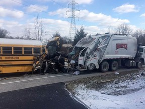 This image provided by the Indiana State Police shows a school bus that collided with a garbage truck, Wednesday, March 6, 2019, near Aurora, Ind, a city about 30 miles west of Cincinnati. Authorities say at least 19 students are hurt in the accident.