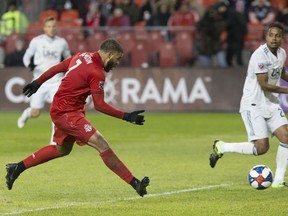 Toronto FC forward Jordan Hamilton (7) slots in his team's second goal against the New England Revolution during first half MLS soccer action in Toronto on Sunday, March 17, 2019.