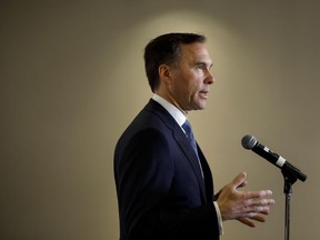 Canadian finance minister Bill Morneau speaks during a press conference following his speech and discussion about the 2019 Federal Budget in Toronto, Wednesday, March 20, 2019.