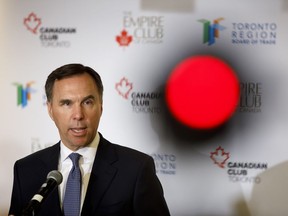 Canadian finance minister Bill Morneau speaks during a press conference following his speech and discussion about the 2019 Federal Budget in Toronto, Wednesday, March 20, 2019.