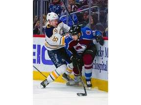 Buffalo Sabres defenseman Rasmus Ristolainen (55) and Colorado Avalanche right wing Mikko Rantanen (96) collide during the first period of an NHL hockey game Saturday, March 9, 2019, in Denver.